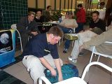 Adept, looking in his bag for one of the many things he brings to each meeting.