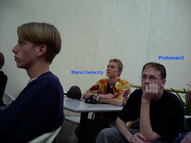ManicVelocity and ProtomanX listening to the talks.