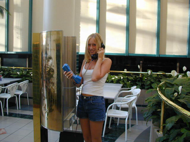 This poor girl just wanted to make a phone call, now shes on the internet, holding a buttset.