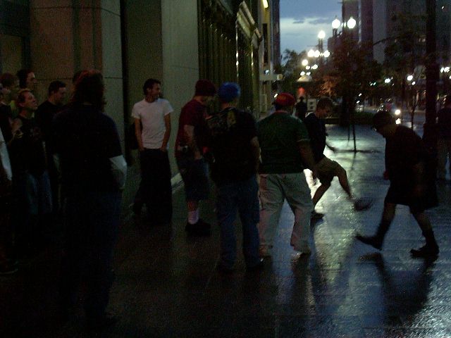 Kicking around a piece of pipe in the rain.