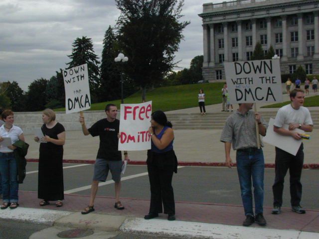 Holding up the signs.