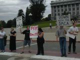 Holding up the signs.