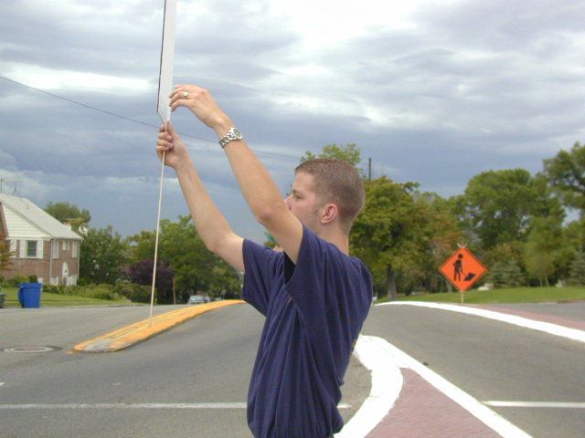 Grifter trying to get people to honk at him.