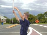 Grifter trying to get people to honk at him.