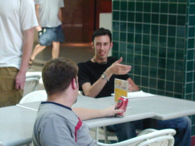 Mutilator shows Adept the proper procedure on how to shake hands.