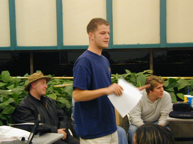 Grifter commands everyone to shut up so he can start his talk.