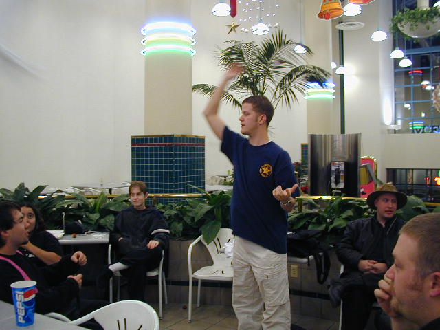 Grifter handing out freebies from ApacheCon.