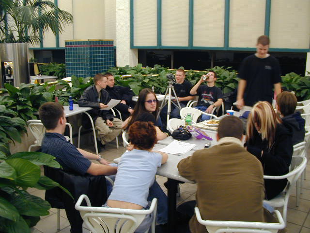 Hanging out, waiting for people to show up so the talks can begin.