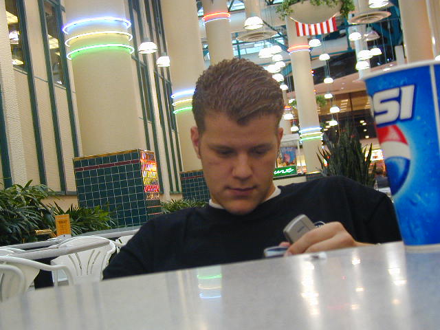 Grifter playing with... um... something... in the middle of the food court.